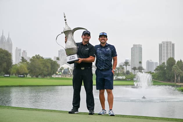 Hero Dubai Desert Classic 2026 DUBAI, UNITED ARAB EMIRATES - JANUARY 25: American golfer Patrick Reed Reed (L) and his caddie Kessler Karain (R) pose for a photo after winning the fourth and final round of the Hero Dubai Desert Classic 2026 at Emirates Golf Club in Dubai, United Arab Emirates on January 25, 2026. Waleed Zein Anadolu Dubai United Arab Emirates. Editorial use only. Please get in touch for any other usage.  Copyright: x2026xAnadoluxWaleedxZeinx