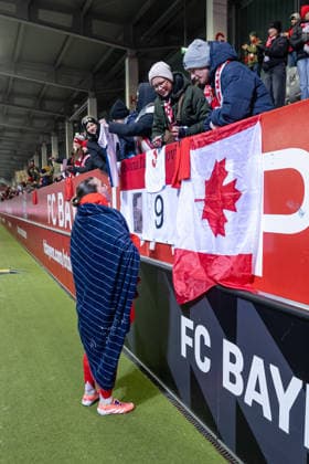 Vanessa Gilles FC Bayern Muenchen Frauen, 02 after the match with her fans with a Canadian flag GER, FC Bayern Muenchen Frauen vs RB Leipzig, Soccer, Google Pixel Frauen Bundesliga, 15 Matchday, Season 2025 2026, 25 01 2026 DFL DFB REGULATIONS PROHIBIT ANY USE OF PHOTOGRAPHS as IMAGE SEQUENCES and or QUASI VIDEO GER, FC Bayern Muenchen Frauen vs RB Leipzig, Football, Google Pixel Frauen Bundesliga, 15 Spieltag, Saison 2025 2026, 25 01 2026 Muenchen Copyright: xEibner-Pressefoto HeikexFeinerx EP_HFR