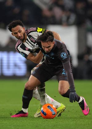 Turin, Italy, 25th January 2026. Lloyd Kelly of Juventus clashes with Giovane of SSC Napoli during the Juventus vs Napoli Serie A match at Allianz Stadium, Turin. Picture credit should read: Jonathan Moscrop Sportimage EDITORIAL USE ONLY. No use with unauthorised audio, video, data, fixture lists, club league logos or live services. Online in-match use limited to 120 images, no video emulation. No use in betting, games or single club league player publications. SPI_118_JM_JUVE_NAPOLI_ SPI-4417-0118