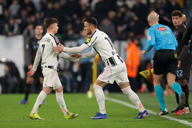 Turin, Italy, 25th January 2026. Filip Kostic of Juventus shakes hands with team mate Francisco Conceicao as he enters the field of play as a second half substitute during the Juventus vs Napoli Serie A match at Allianz Stadium, Turin. Picture credit should read: Jonathan Moscrop Sportimage EDITORIAL USE ONLY. No use with unauthorised audio, video, data, fixture lists, club league logos or live services. Online in-match use limited to 120 images, no video emulation. No use in betting, games or single club league player publications. SPI_159_JM_JUVE_NAPOLI_ SPI-4417-0159