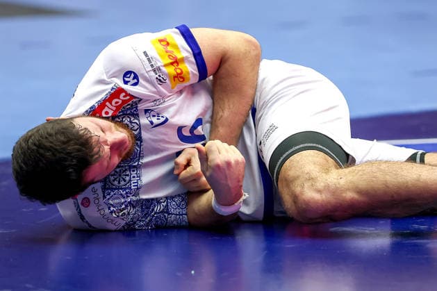 26 01 2026, Handball, Men s EHF EURO 2026, Norway Portugal, Jyske Bank Boxing in Herning, Denmark, Main Round Joao Pedro Vinhas Silva Gomes Portugal 66 with pain on the ground Denmark