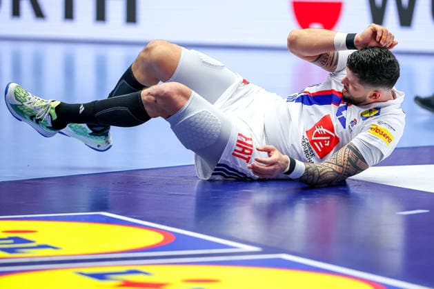 26 01 2026, Handball, Men s EHF EURO 2026, France Spain, Jyske Bank Boxing in Herning, Denmark, Main Round Ludovic Fabregas France 23 lies disappointed with pain disappointment on the pitch Denmark