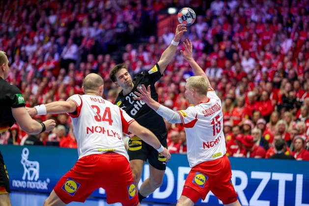 26 01 2026, Handball, Men s EHF EURO 2026, Germany Denmark, Jyske Bank Boxen in Herning, Denmark, Main Round Renars Uscins Germany 23 in duel against Simon Hald Jensen Denmark 34 Magnus Saugstrup Jensen Denmark 15 Denmark