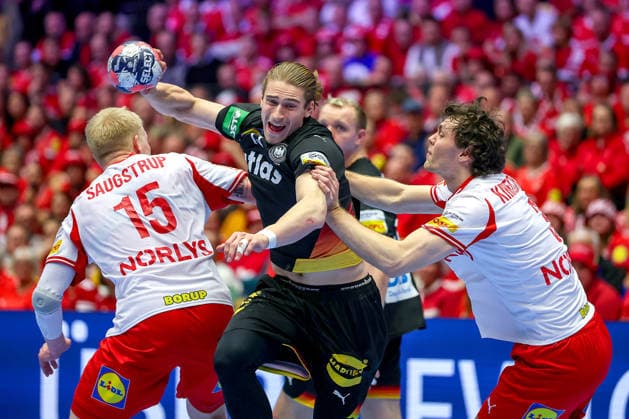 26 01 2026, Handball, Men s EHF EURO 2026, Germany Denmark, Jyske Bank Boxen in Herning, Denmark, Main Round Juri Knorr Germany 15 in a duel against Magnus Saugstrup Jensen Denmark 15 Niclas Vest Kirkelokke Denmark 03 Denmark