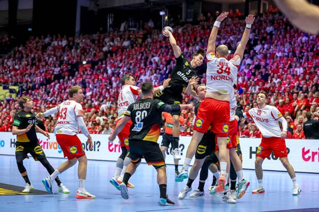 26 01 2026, Handball, Men s EHF EURO 2026, Germany Denmark, Jyske Bank Boxen in Herning, Denmark, Main Round Miro Schluroff Germany 05 throws the ball on goal over defense Magnus Saugstrup Jensen Denmark 15 Simon Hald Jensen Denmark 34 Rasmus Lauge Schmidt Denmark 11 Mathias Gidsel Denmark 19 Denmark