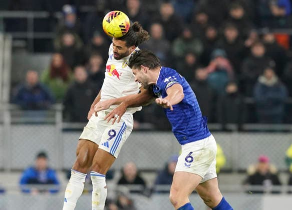 Liverpool, England, 26th January 2026. Dominic Calvert-Lewin of Leeds United and James Tarkowski of Everton during the Everton vs Leeds United Premier League match at Hill Dickinson Stadium, Liverpool. Picture credit should read: Andrew Yates Sportimage EDITORIAL USE ONLY. No use with unauthorised audio, video, data, fixture lists, club league logos or live services. Online in-match use limited to 120 images, no video emulation. No use in betting, games or single club league player publications. SPI_044_AY_Everton_Leeds SPI-4481-0043