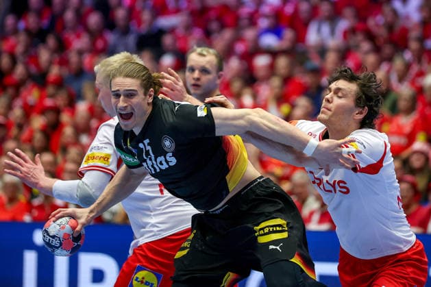 26 01 2026, Handball, Men s EHF EURO 2026, Germany Denmark, Jyske Bank Boxen in Herning, Denmark, Main Round Juri Knorr Germany 15 in a duel against Magnus Saugstrup Jensen Denmark 15 Niclas Vest Kirkelokke Denmark 03 Denmark