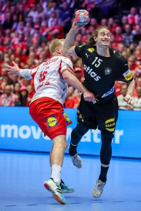 26 01 2026, Handball, Men s EHF EURO 2026, Germany Denmark, Jyske Bank Boxen in Herning, Denmark, Main Round Juri Knorr Germany 15 in duel against Magnus Saugstrup Jensen Denmark 15 throws the ball at the goal Denmark