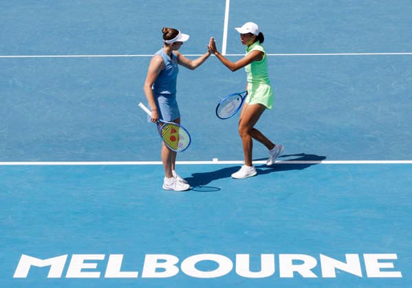 (260128) -- MELBOURNE, Jan. 28, 2026 -- Zhang Shuai (R) Elise Mertens react during the women s doubles quarterfinal match between Zhang Shuai (China) Elise Mertens (Belgium) and Wu Fang-Hsien (Chinese Taipei) Hozumi Eri (Japan) at the Australian Open tennis tournament in Melbourne, Australia, Jan. 28, 2026. ) (SP)AUSTRALIA-MELBOURNE-TENNIS-AUSTRALIAN OPEN-WOMEN S DOUBLES-QUARTERFINALS MaxPing 