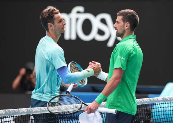 Lorenzo Musetti ITA bids farewell to Novak Djokovic after retiring due to injury, Australian Open 2026 Melbourne Park, Melbourne, Victoria, Australia Copyright: xJuergenxHasenkopfx