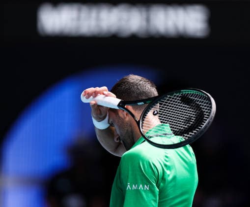 (260128) -- MELBOURNE, Jan. 28, 2026 -- Novak Djokovic of Serbia reacts during the men s singles quarterfinal match between Novak Djokovic of Serbia and Lorenzo Musetti of Italy at the Australian Open tennis tournament in Melbourne, Australia, Jan. 28, 2026. ) (SP)AUSTRALIA-MELBOURNE-TENNIS-AUSTRALIAN OPEN-MEN S SINGLES-QUARTERFINALS MaxPing 