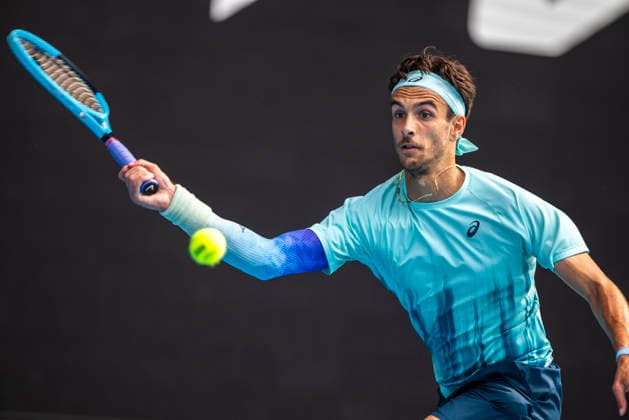 (260128) -- MELBOURNE, Jan. 28, 2026 -- Lorenzo Musetti of Italy hits a return during the men s singles quarterfinal match between Novak Djokovic of Serbia and Lorenzo Musetti of Italy at the Australian Open tennis tournament in Melbourne, Australia, Jan. 28, 2026. (Photo by Xinhua) (SP)AUSTRALIA-MELBOURNE-TENNIS-AUSTRALIAN OPEN-MEN S SINGLES-QUARTERFINALS HuxJingchen 