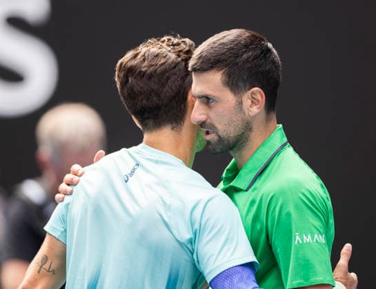(260128) -- MELBOURNE, Jan. 28, 2026 -- Novak Djokovic (R) of Serbia greets with Lorenzo Musetti of Italy during the men s singles quarterfinal match between Novak Djokovic of Serbia and Lorenzo Musetti of Italy at the Australian Open tennis tournament in Melbourne, Australia, Jan. 28, 2026. (Photo by Xinhua) (SP)AUSTRALIA-MELBOURNE-TENNIS-AUSTRALIAN OPEN-MEN S SINGLES-QUARTERFINALS HuxJingchen 