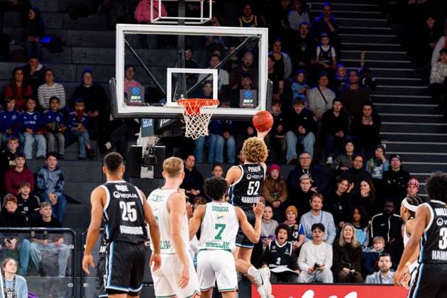 Game action with Zacharie Perrin 52 Veolia Towers Hamburg throwing, Kenneth Ogbe 25 Veolia Towers Hamburg and Jakub Urbaniak 7 Slask Wroclaw defending, Ross Williams 34 Veolia Towers Hamburg watching Zacharie Perrin 52 Veolia Towers Hamburg throwing at the basket Copyright: xPhilippHeistx
