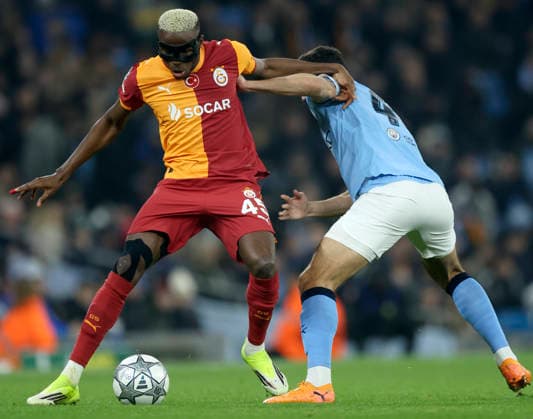 Manchester City v Galatasaray A.S. - UEFA Champions League 2025 26 League Phase MD8 Victor Osimhen of Galatasaray A.S. and Abdukodir Khusanov of Manchester City challenge during the UEFA Champions League 2025 26 League Phase MD8 match between Manchester City and Galatasaray A.S. at City of Manchester Stadium on January 28, 2026 in Manchester, England. WARNING! This Photograph May Only Be Used For Newspaper And Or Magazine Editorial Purposes. May Not Be Used For Publications Involving 1 player, 1 Club Or 1 Competition Without Written Authorisation From Football DataCo Ltd. For Any Queries, Please Contact Football DataCo Ltd on +44 (0) 207 864 9121 Manchester City of Manchester Stadium England United Kingdom Copyright: xAllstarxPicturexLibraryxLtdx