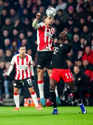 EINDHOVEN - (l-r) Armando Obispo of PSV Eindhoven, Nicolas Jackson of FC Bayern Munich during the UEFA Champions League match between PSV Eindhoven and FC Bayern Munich at the Phillips Stadium on January 28, 2026, in Eindhoven, Netherlands. BART STOUTJESDIJK ANP UEFA Champions League 2025-2026 xVIxANPxSportx xxANPxIVx 548918641 originalFilename: 548918641.jpg