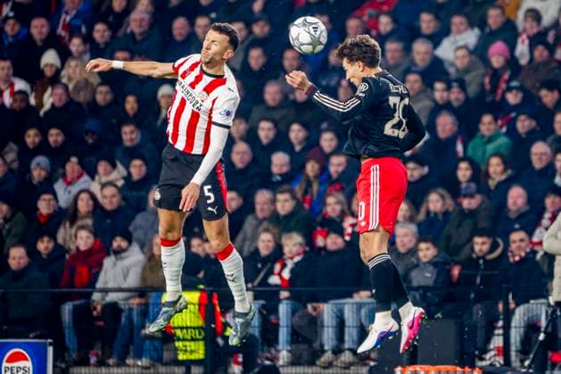 Tom Bischof of FC Bayern Munchen and Ivan Perisic of PSV Eindhoven compete for the headed ball PSV Eindhoven v FC Bayern Munchen, UEFA Champions League 2025 26 League Phase MD8, PSV Eindhoven v FC Bayern Munchen, PSV Stadion, January 28, 2026, Eindhoven, Netherlands.