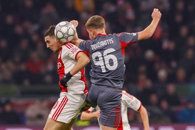 2026-01-28 AFC Ajax v Olympiacos FC - UEFA Champions League AMSTERDAM, NETHERLANDS - JANUARY 28: Oscar Gloukh of AFC Ajax, Christos Mouzakitis of Olympiacos FC during the UEFA Champions League match between AFC Ajax and Olympiacos FC at Johan Cruijff ArenA on January 28, 2026 in Amsterdam, Netherlands. Amsterdam Johan Cruijff ArenA Netherlands Content not available for redistribution in The Netherlands directly or indirectly through any third parties. Copyright: xBenxGalx