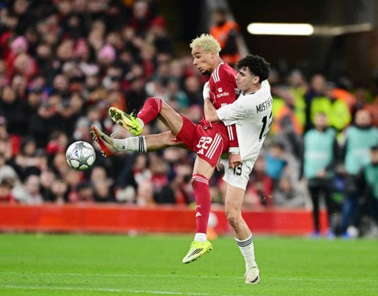 Liverpool, England, 28th January 2026. Hugo Ekitike of Liverpool tackled by Bahlul Mustafazade of FK Qarabag during the Liverpool vs Qarabag FK UEFA Champions League match at Anfield, Liverpool. Picture credit should read: Harriet Massey Sportimage EDITORIAL USE ONLY. No use with unauthorised audio, video, data, fixture lists, club league logos or live services. Online in-match use limited to 120 images, no video emulation. No use in betting, games or single club league player publications. SPI_040_HM_Lpool_Qarabag SPI-4487-0039