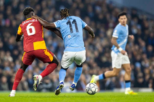 28th January 2026; Etihad Stadium, Manchester, England; UEFA Champions League Football, Manchester City versus Galatasaray; Jeremy Doku of Manchester City is tackled by Davinson Sanchez of Galatasaray  TimxWilliams Content restricted for UK based newspaper