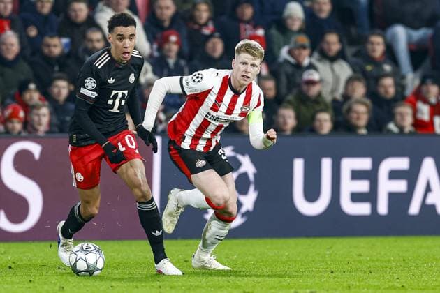 EINDHOVEN , 28-01-2026 , Philips Stadium , season 2025 2026 , UEFA Champions League football , League phase matchday 8 , match between PSV and Bayern Munchen , picture shows Bayern Munchen player Jamal Musiala and PSV player Jerdy Schouten PSV - Bayern Munchen  x201145508x Copyright: