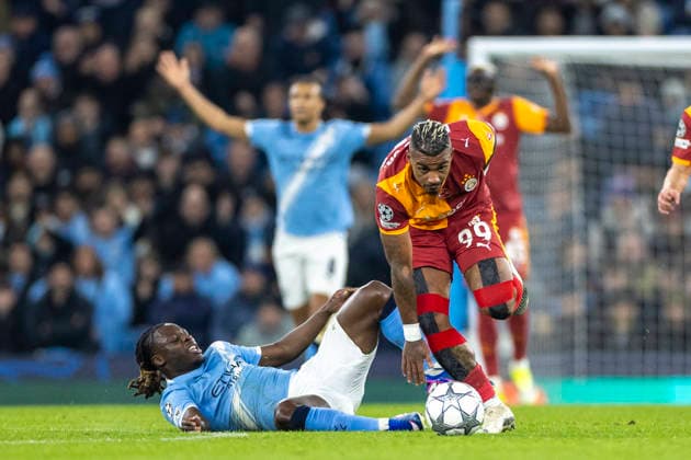 28th January 2026; Etihad Stadium, Manchester, England; UEFA Champions League Football, Manchester City versus Galatasaray; Mario Lemina of Galatasaray is tackled by Jeremy Doku of Manchester City  TimxWilliams Content restricted for UK based newspaper
