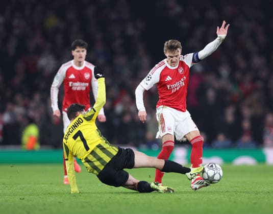 London, England, 28th January 2026. Jorginho of FC Kairat Almaty tackles Martin Odegaard of Arsenal during the Arsenal vs Kairat Almaty UEFA Champions League match at the Emirates Stadium, London. Picture credit should read: David Klein Sportimage EDITORIAL USE ONLY. No use with unauthorised audio, video, data, fixture lists, club league logos or live services. Online in-match use limited to 120 images, no video emulation. No use in betting, games or single club league player publications. SPI_047_DK_Arsenal_Alamty SPI-4488-0047