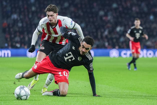 Soccer Champions League matchday 8 PSV Eindhoven FC Bayern Munich on 28 01 2026 at Philips Stadion in Eindhoven Jamal Musiala Munich , front Paul Wanner Eindhoven , back xJRx