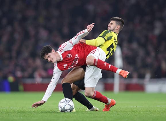 London, England, 28th January 2026. Christian Norgaard of Arsenal tackled by Valeri Gromyko of FC Kairat Almaty during the Arsenal vs Kairat Almaty UEFA Champions League match at the Emirates Stadium, London. Picture credit should read: David Klein Sportimage EDITORIAL USE ONLY. No use with unauthorised audio, video, data, fixture lists, club league logos or live services. Online in-match use limited to 120 images, no video emulation. No use in betting, games or single club league player publications. SPI_048_DK_Arsenal_Alamty SPI-4488-0048