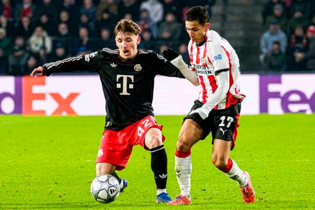 Mauro Junior of PSV Eindhoven battles for possession with Lennart Karl of FC Bayern Munchen PSV Eindhoven v FC Bayern Munchen, UEFA Champions League 2025 26 League Phase MD8, PSV Eindhoven v FC Bayern Munchen, PSV Stadion, January 28, 2026, Eindhoven, Netherlands.