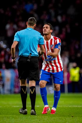 Atletico de Madrid v FK Bodo Glimt - UEFA Champions League 2025 26 League Phase MD8 Jorge Resurreccion Koke of Atletico de Madrid (R) talks to referee Maurizio Mariani (L) during the UEFA Champions League 2025 26 League Phase MD8 match between Atletico de Madrid and FK Bodo Glimt at Estadio Riyadh Air Metropolitano on January 28, 2026 in Madrid, Spain. Madrid Estadio Riyadh Air Metropolitano Madrid Spain Copyright: xAlbertoxGardinx AGardin_20260128_Foot_Cham_Atl_Mad_Bod_0775