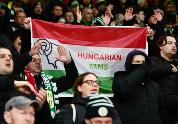 Nottingham, England, 29th January 2026. Ferencvaros fans display a banner claiming to be supporting Nottingham Forest local Rivals Derby County before the game the Nottingham Forest vs Ferencvaros UEFA Europa League match at the City Ground, Nottingham. Picture credit should read: Harriet Massey Sportimage EDITORIAL USE ONLY. No use with unauthorised audio, video, data, fixture lists, club league logos or live services. Online in-match use limited to 120 images, no video emulation. No use in betting, games or single club league player publications. SPI_021_HM_Forest_Ferencvaros SPI-4491-0022
