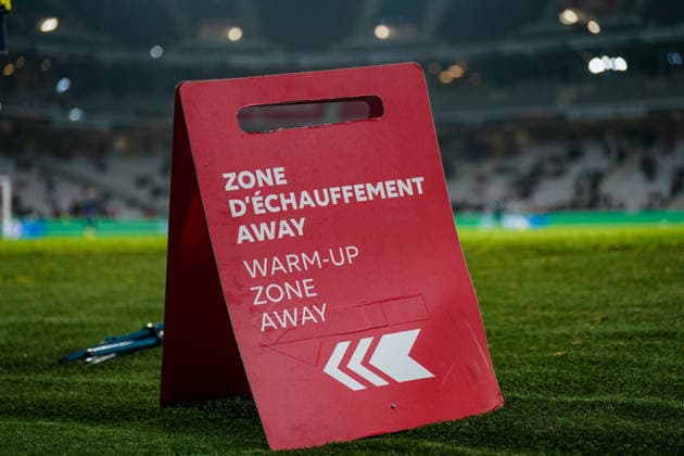 Football UEFA Europa League 2025 26, Matchday 8 OSC Lille vs SC Freiburg Stade Pierre Mauroy Lille, France Away warm-up zone sign on the edge of the pitch, marked warm-up area for the visiting team, stadium interior, pitch, floodlights, match organization, safety and operational structure, UEFA regulations, match preparation, team logistics, European Cup, professional infrastructure, international match, soccer evening, France, Europe Copyright: xJOERANxSTEINSIEKx