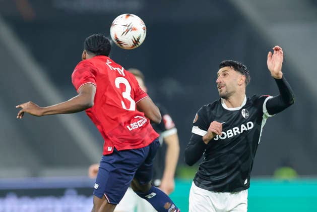 Nathan Ngoy OSC Lille and Vincenzo Grifo SC Freiburg battle for the ball, UEFA Europa League 2025 26 League Phase MD8, LOSC Lille v SC Freiburg, Stade Pierre Mauroy on January 29, 2026 in Lille, France Photo by Marco Steinbrenner DeFodi Images Nathan Ngoy OSC Lille and Vincenzo Grifo SC Freiburg battle for the ball, UEFA Europa League 2025 26 League Phase MD8, LOSC Lille v SC Freiburg, Stade Pierre Mauroy, January 29, 2026 in Lille, France Photo by Marco Steinbrenner DeFodi Images