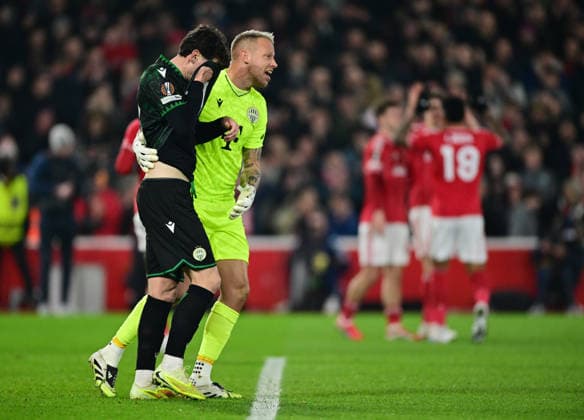Nottingham, England, 29th January 2026. David Grof of Ferencvaros comforts Bence Otvos of Ferencvaros following his own goal during the Nottingham Forest vs Ferencvaros UEFA Europa League match at the City Ground, Nottingham. Picture credit should read: Harriet Massey Sportimage EDITORIAL USE ONLY. No use with unauthorised audio, video, data, fixture lists, club league logos or live services. Online in-match use limited to 120 images, no video emulation. No use in betting, games or single club league player publications. SPI_036_HM_Forest_Ferencvaros SPI-4491-0036