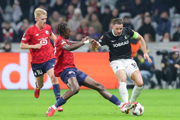 Hakon Arnar Haraldsson OSC Lille , Ngal Ayel Mukau OSC Lille and Christian Guenter SC Freiburg battle for the ball, UEFA Europa League 2025 26 League Phase MD8, LOSC Lille v SC Freiburg, Stade Pierre Mauroy on January 29, 2026 in Lille, France Photo by Marco Steinbrenner DeFodi Images Hakon Arnar Haraldsson OSC Lille , Ngal Ayel Mukau OSC Lille and Christian Guenter SC Freiburg battle for the ball, UEFA Europa League 2025 26 League Phase MD8, LOSC Lille v SC Freiburg, Stade Pierre Mauroy, January 29, 2026 in Lille, France Photo by Marco Steinbrenner DeFodi Images