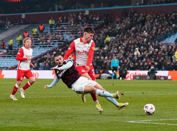 Birmingham, England, 29th January 2026. Emiliano Buendia of Aston Villa is tackled by Tim Trummer of Red Bull Salzburg during the Aston Villa vs FC Salzburg UEFA Europa League match at Villa Park, Birmingham. Picture credit should read: Andrew Yates Sportimage EDITORIAL USE ONLY. No use with unauthorised audio, video, data, fixture lists, club league logos or live services. Online in-match use limited to 120 images, no video emulation. No use in betting, games or single club league player publications. SPI_042_AY_Villa_Salzburg SPI-4490-0041