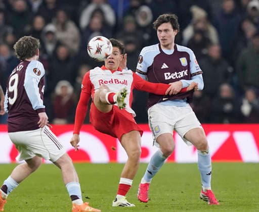 Birmingham, England, 29th January 2026. Victor Lindelof of Aston Villa (r) tackles Clement Bischoff of Red Bull Salzburg (l) during the Aston Villa vs FC Salzburg UEFA Europa League match at Villa Park, Birmingham. Picture credit should read: Andrew Yates Sportimage EDITORIAL USE ONLY. No use with unauthorised audio, video, data, fixture lists, club league logos or live services. Online in-match use limited to 120 images, no video emulation. No use in betting, games or single club league player publications. SPI_061_AY_Villa_Salzburg SPI-4490-0060