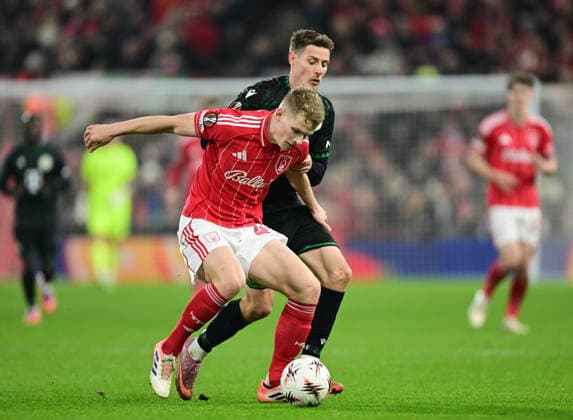 Nottingham, England, 29th January 2026. Zach Abbott of Nottingham Forest tussles with Kristoffer Zachariassen of Ferencvaros during the Nottingham Forest vs Ferencvaros UEFA Europa League match at the City Ground, Nottingham. Picture credit should read: Harriet Massey Sportimage EDITORIAL USE ONLY. No use with unauthorised audio, video, data, fixture lists, club league logos or live services. Online in-match use limited to 120 images, no video emulation. No use in betting, games or single club league player publications. SPI_055_HM_Forest_Ferencvarosx SPI-4491-0054