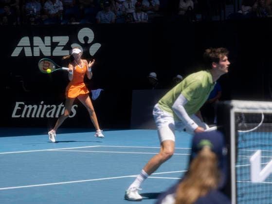 (260130) -- MELBOURNE, Jan. 30, 2026 -- Kristina Mladenovic (L) Manuel Guinard compete during the mixed doubles final match between Olivia Gadecki John Peers of Australia and Kristina Mladenovic Manuel Guinard of France at the Australian Open tennis tournament in Melbourne, Australia, Jan. 30, 2026. (Photo by Xinhua) (SP)AUSTRALIA-MELBOURNE-TENNIS-AUSTRALIAN OPEN-MIXED DOUBLES-FINAL HuxJingchen 