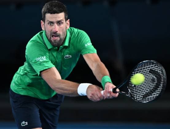 (260130) -- MELBOURNE, Jan. 30, 2026 -- Novak Djokovic hits a return during the men s singles semifinal match between Novak Djokovic of Serbia and Jannik Sinner of Italy at the Australian Open tennis tournament in Melbourne, Australia, Jan. 31, 2026. (Photo by Xinhua) (SP)AUSTRALIA-MELBOURNE-TENNIS-AUSTRALIAN OPEN-MEN S SINGLES-SEMIFINAL WangxShen 