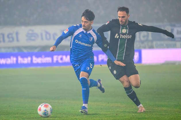 In the picture, from left Laurin Ulrich 1 FC Magdeburg , Virgil¯GhiÅ£a¯ Hannover¯96 , Action, duels, fighting for the ball, GER, Magdeburg, 1 FC Magdeburg vs Hannover 96, 2 Bundesliga, soccer, DFB, 2025 2026 season, AVNET Arena, match day, DFB DFL REGULATIONS PROHIBIT ANY USE OF PHOTOGRAPHS AS IMAGE SEQUENCES AND OR QUASI VIDEO, 30 01 2026, Copyright: HMBxMedia UwexKoch