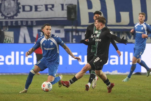 30 01 2026, xgox, Soccer 2 Bundesliga, 1 FC Magdeburg Hannover 96 emspor, v l Falko Michel Magdeburg, 21 , Benjamin Källman Hannover, 9 DFL DFB REGULATIONS PROHIBIT ANY USE OF PHOTOGRAPHS as IMAGE SEQUENCES and or QUASI VIDEO Magdeburg