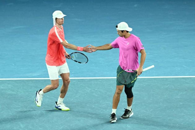 TENNIS AUSTRALIAN OPEN, Jason Kubler (pink) and Marc Polmans (red) of Australia in action during the men™s doubles final against Christian Harrison of the USA and Neal Skupski of Great Britian on day 14 of the 2026 Australian Open tennis tournament at Melbourne Park in Melbourne, Saturday, January 31, 2026. ( NO ARCHIVING MELBOURNE VICTORIA AUSTRALIA  Copyright: xJOELxCARRETTx 20260131131992207519