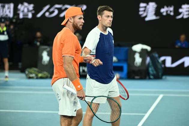TENNIS AUSTRALIAN OPEN, Christian Harrison (orange) of the USA and Neal Skupski (blue) of Great Britian in action during the men™s doubles final against Jason Kubler (pink) and Marc Polmans (red) of Australia on day 14 of the 2026 Australian Open tennis tournament at Melbourne Park in Melbourne, Saturday, January 31, 2026. ( NO ARCHIVING MELBOURNE VICTORIA AUSTRALIA  Copyright: xJOELxCARRETTx 20260131157699027703