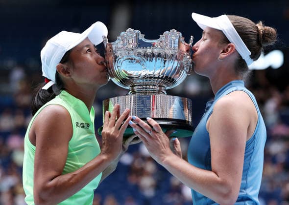 (260131) -- MELBOURNE, Jan. 31, 2026 -- Zhang Shuai (L) Elise Mertens kiss the trophy during the awarding ceremony for the women s doubles final match between Zhang Shuai (China) Elise Mertens (Belgium) and Anna Danilina (Kazakhstan) Aleksandra Krunic (Serbia) at the Australian Open tennis tournament in Melbourne, Australia, Jan. 31, 2026. ) (SP)AUSTRALIA-MELBOURNE-TENNIS-AUSTRALIAN OPEN-WOMEN S DOUBLES-FINAL MaxPing 