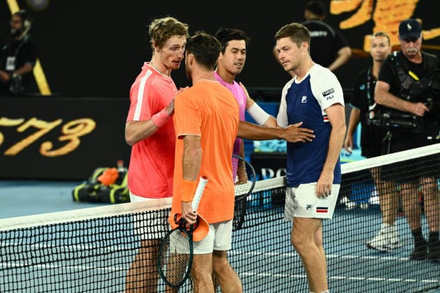 TENNIS AUSTRALIAN OPEN, Jason Kubler (pink) and Marc Polmans of Australia congratulate Christian Harrison of the USA and Neal Skupski of Great Britian after loosing the the men™s doubles final on day 14 of the 2026 Australian Open tennis tournament at Melbourne Park in Melbourne, Saturday, January 31, 2026. ( NO ARCHIVING MELBOURNE VICTORIA AUSTRALIA  Copyright: xJOELxCARRETTx 20260131174056780387