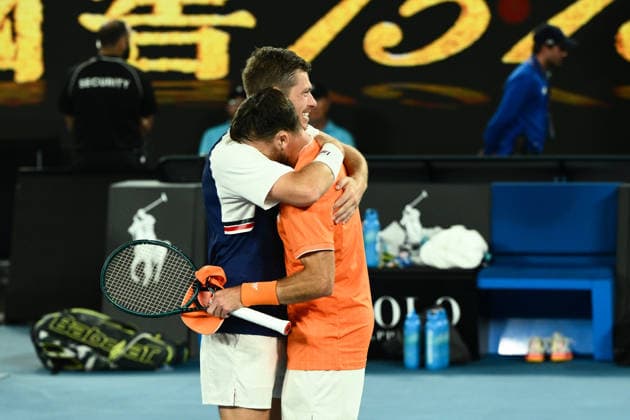 TENNIS AUSTRALIAN OPEN, Christian Harrison (orange) of the USA and Neal Skupski (blue) of Great Britian celebrate after winning the men™s doubles final against Jason Kubler (pink) and Marc Polmans (red) of Australia on day 14 of the 2026 Australian Open tennis tournament at Melbourne Park in Melbourne, Saturday, January 31, 2026. ( NO ARCHIVING MELBOURNE VICTORIA AUSTRALIA  Copyright: xJOELxCARRETTx 20260131164781634910