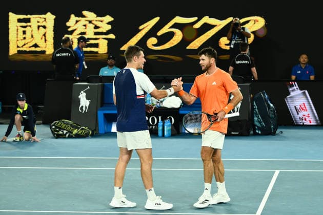 TENNIS AUSTRALIAN OPEN, Christian Harrison (orange) of the USA and Neal Skupski (blue) of Great Britian celebrate after winning the men™s doubles final against Jason Kubler (pink) and Marc Polmans (red) of Australia on day 14 of the 2026 Australian Open tennis tournament at Melbourne Park in Melbourne, Saturday, January 31, 2026. ( NO ARCHIVING MELBOURNE VICTORIA AUSTRALIA  Copyright: xJOELxCARRETTx 20260131188233963467