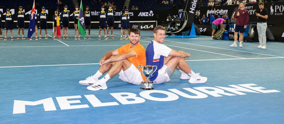 (260131) -- MELBOURNE, Jan. 31, 2026 -- Christian Harrison (L) Neal Skupski pose for photos with the trophy during the awarding ceremony for the men s doubles final match between Jason Kubler Marc Polmans (Australia) and Christian Harrison (the United States) Neal Skupski (Britain) at the Australian Open tennis tournament in Melbourne, Australia, Jan. 31, 2026. (Photo by Xinhua) (SP)AUSTRALIA-MELBOURNE-TENNIS-AUSTRALIAN OPEN-MEN S DOUBLES-FINAL HuxJingchen 
